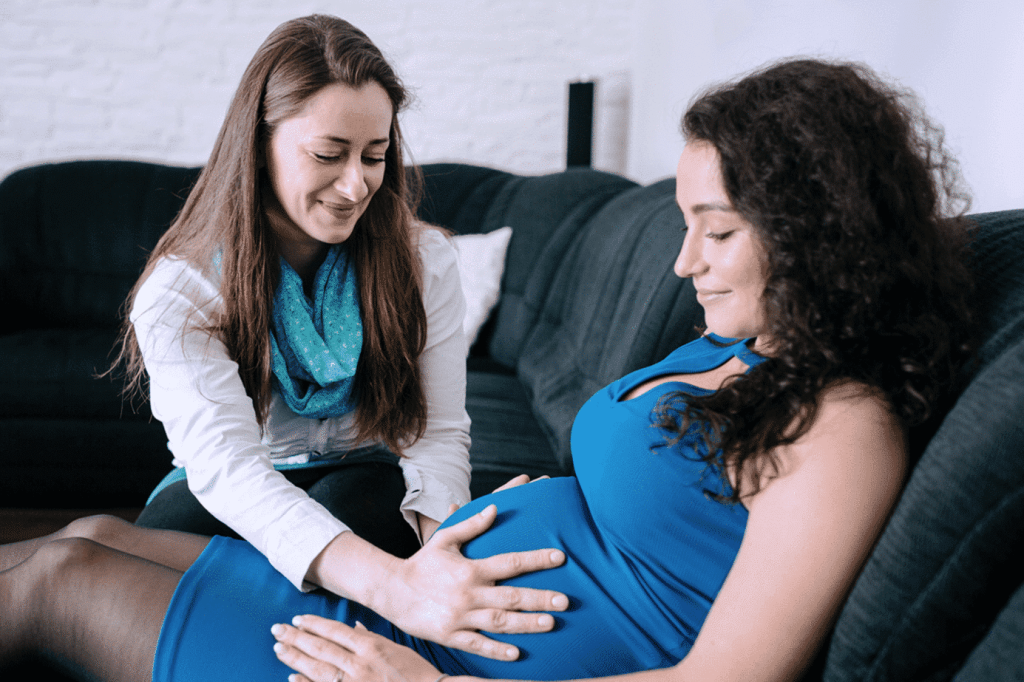 doula supporting mother