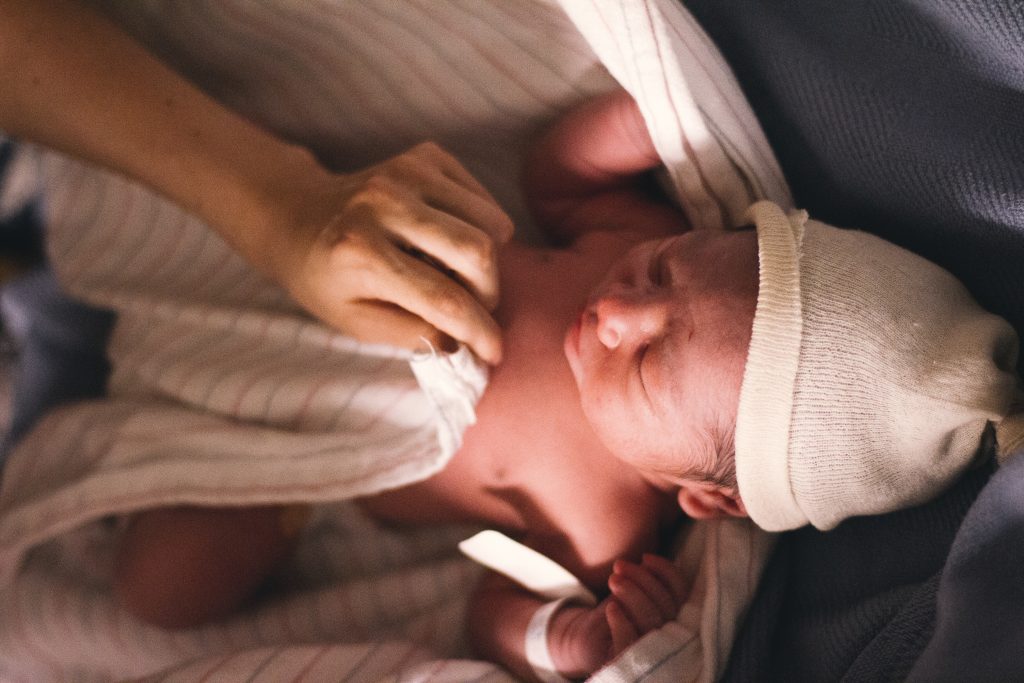 newborn baby wrapped in blanket