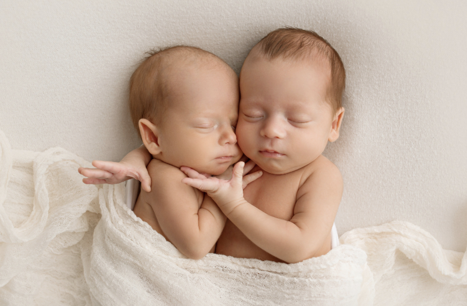 baby sleeping in bed with parents