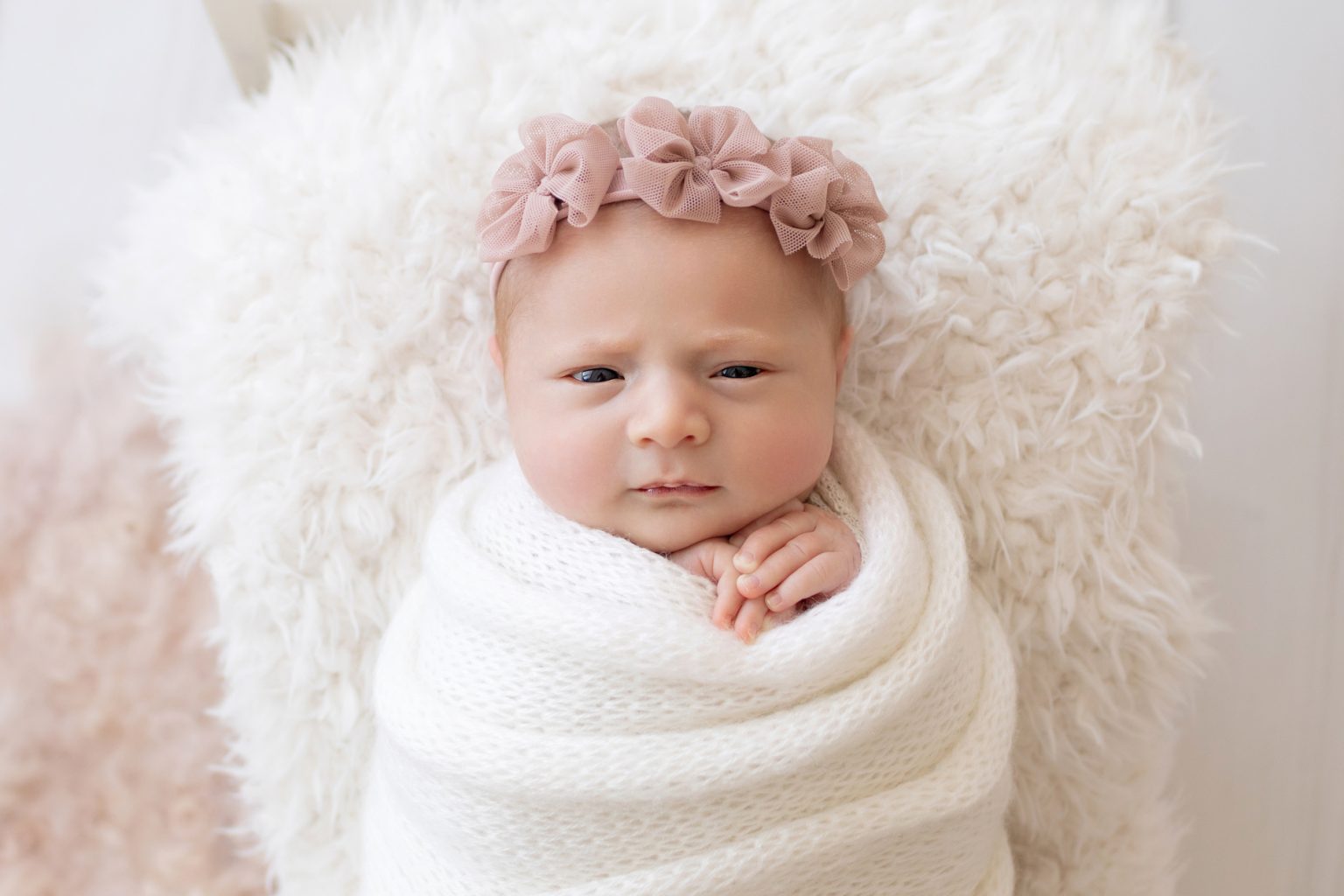 baby sleeping in bed with parents